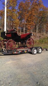 black and red carriage on the trailer